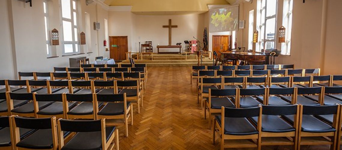 Empty chairs in the church awaiting wedding guests